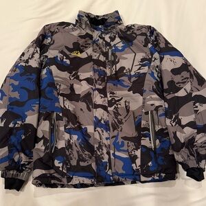 Extreme Outfitter’s Camouflage Jacket with Blue Accents.